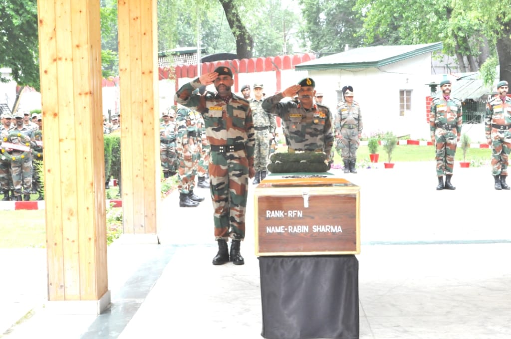 army paid tributes to martyrs of naugam