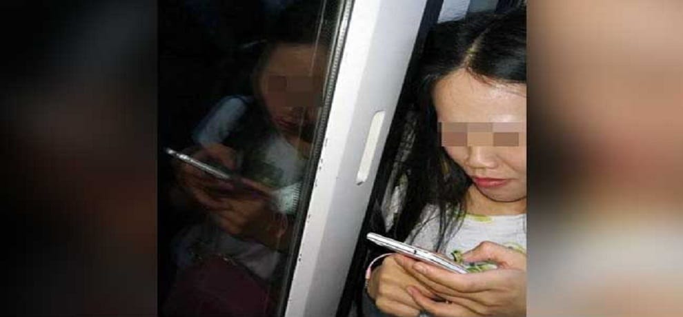 Woman Stands With Hair Stuck In Train's Doors