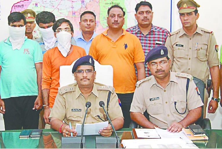 Three youths holding betting on IPL match