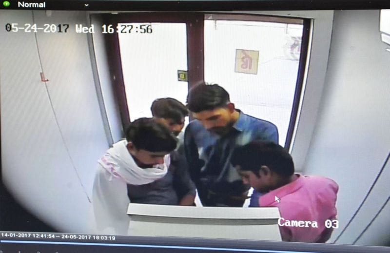 Capture in ATM hacker camera extracting money