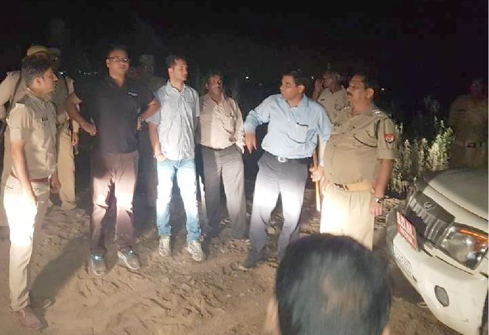 Trying to drive vehicles on police personnel 