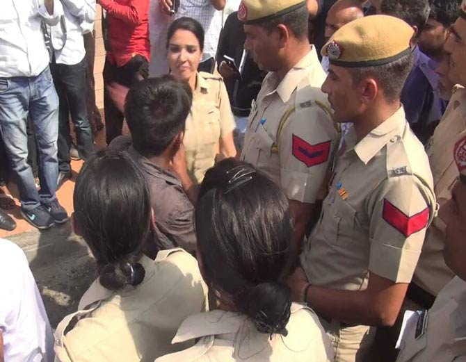 boy was capturing video of girls, brutally beaten by lady police on road at kaithal