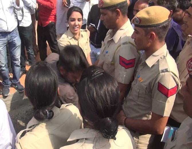 boy was capturing video of girls, brutally beaten by lady police on road at kaithal