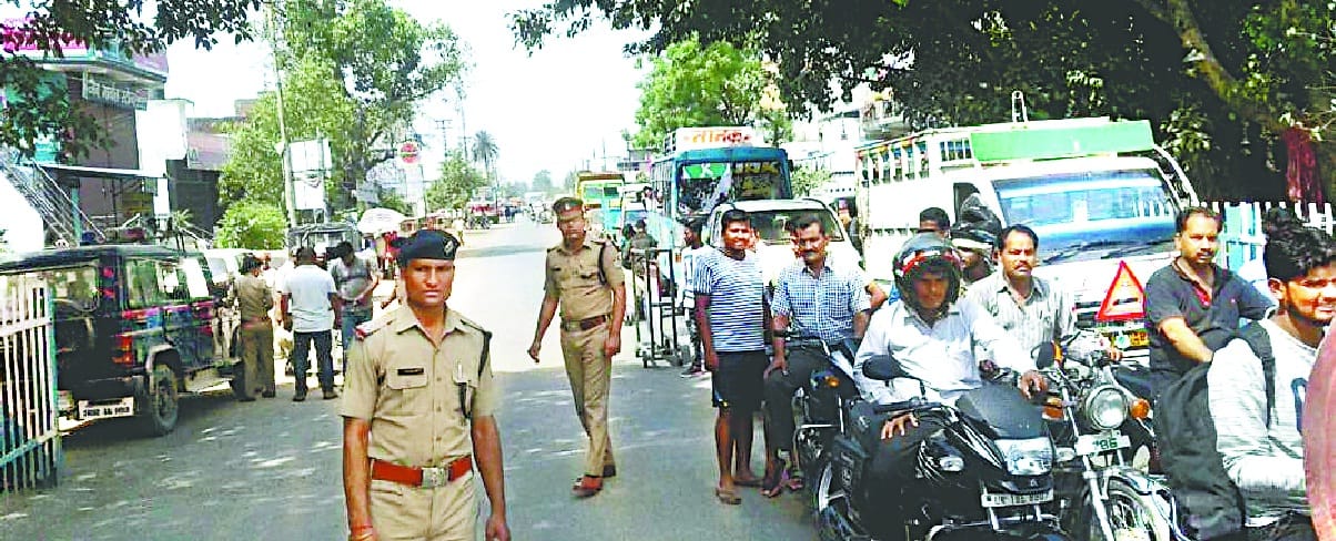 Police administration bribeed on both sides of the railway crossing