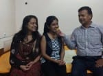 टापर का मुह मीठा करते माता पिता