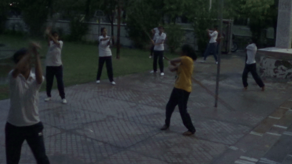 Girls learning sword and sticks