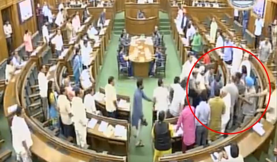 see photos how kapil mishra was taken out of delhi assembly by aam admi party leaders