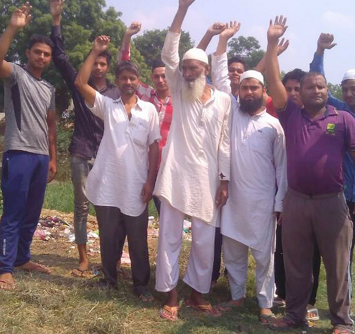  villagers protest by occupying the pond.