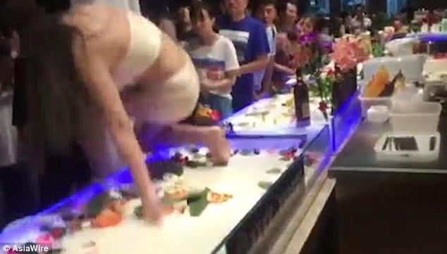 Model hired as a human sushi platter in japan male customer groped her
