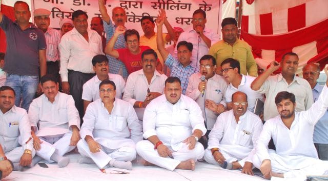 Trader sitting on signatories against sealing