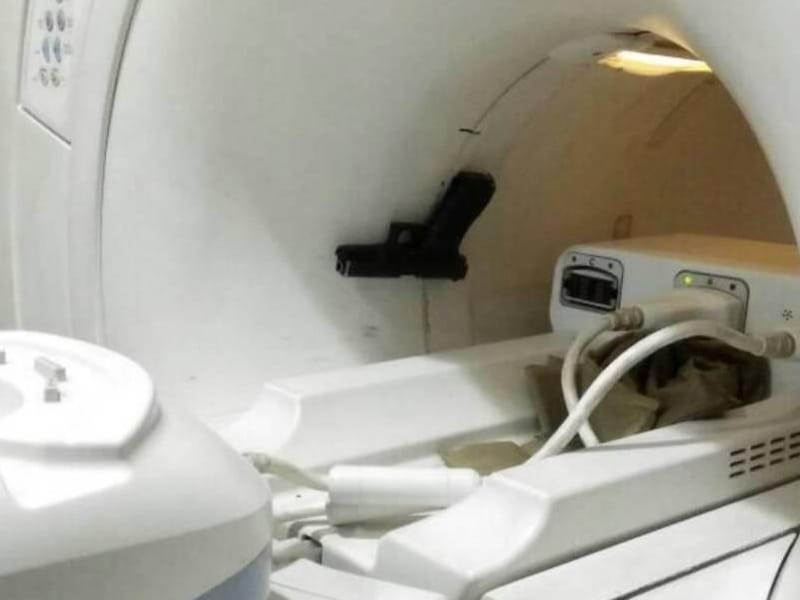 gunner of minister suspended for having gun in MRI room.