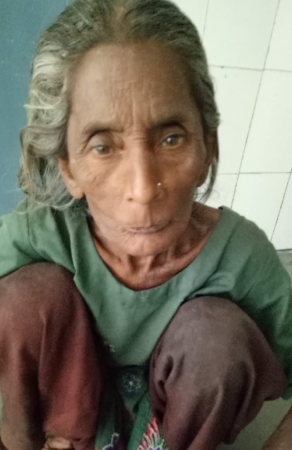 doon hospital old lady waiting for treatment