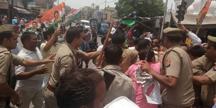 indian national congress workers and police clash in aligarh over protest against cm yogi adityanath