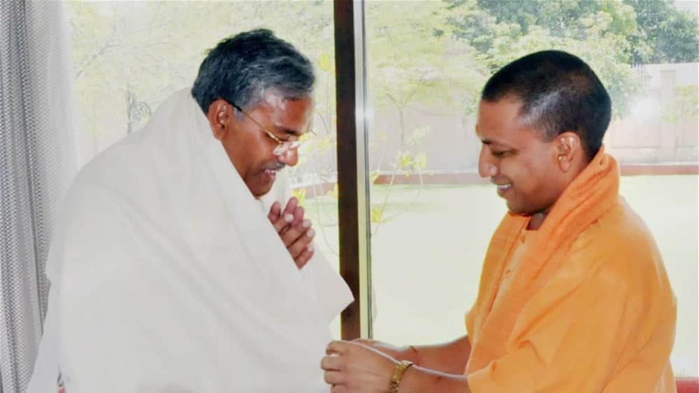 yogi adityanath action made embarrassing trivendra singh rawat 