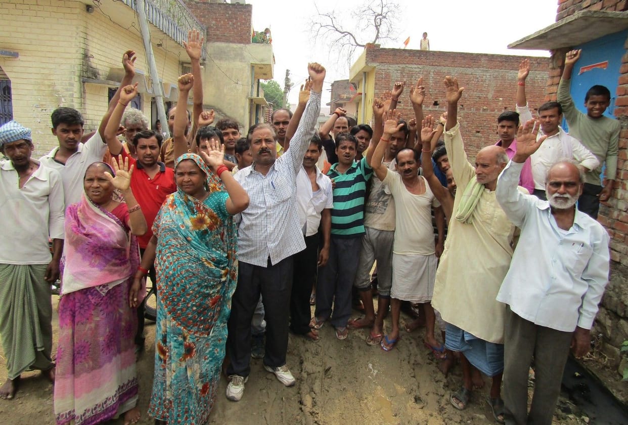 agitation for repair of road 