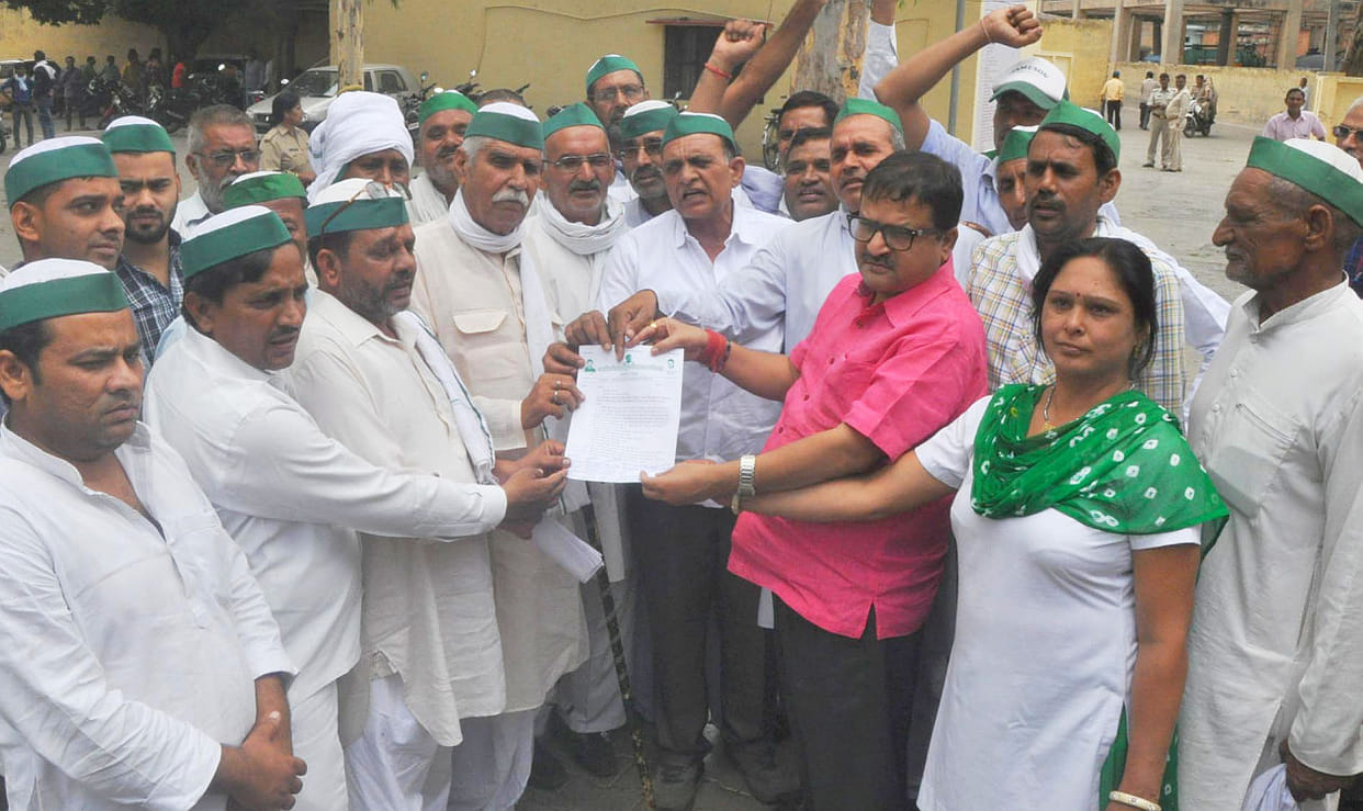 BKU protested against firing on farmers.