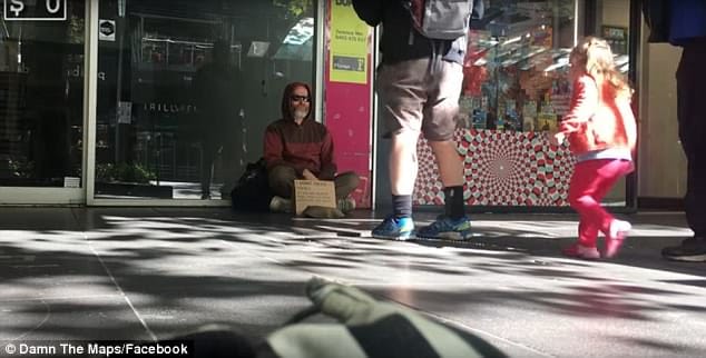 a man like a beggar is providing 100 dollar coin