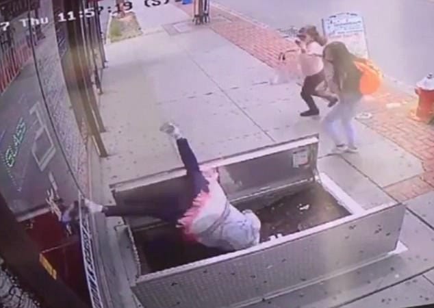 woman, 67, distracted by her phone plunged in to an open sidewalk door