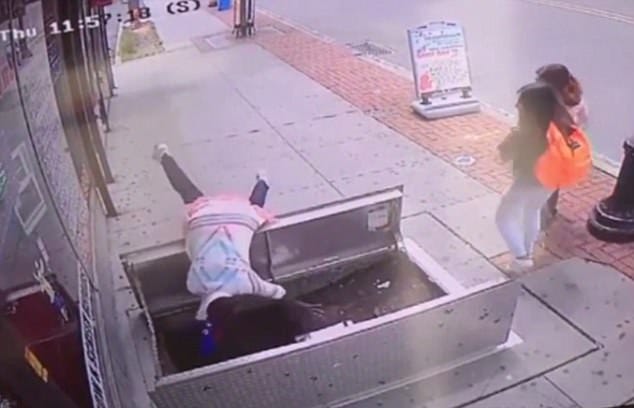 woman, 67, distracted by her phone plunged in to an open sidewalk door