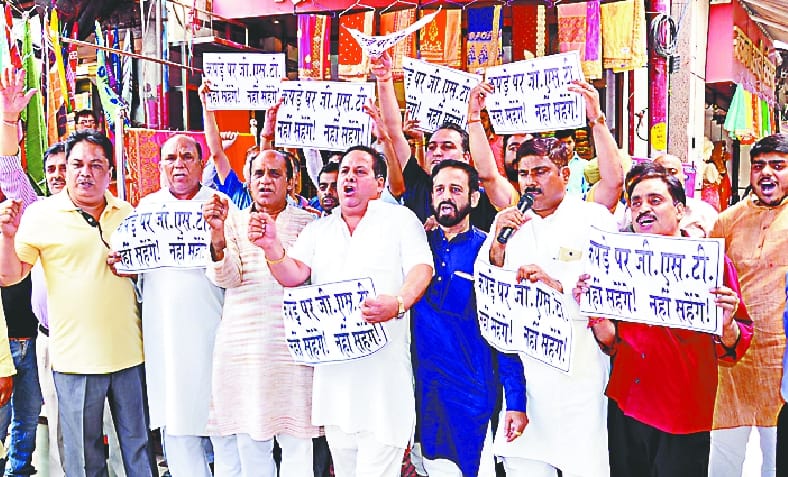 Demonstrators demonstrate against GST