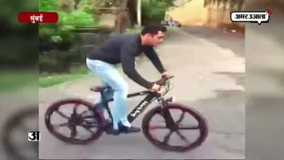 BOLLYWOOD STAR SALMAN KHAN RIDES HIS E CYCLE ON MUMBAI STREETS