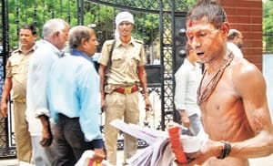 Farmer blows head in DM's office, try self-harm