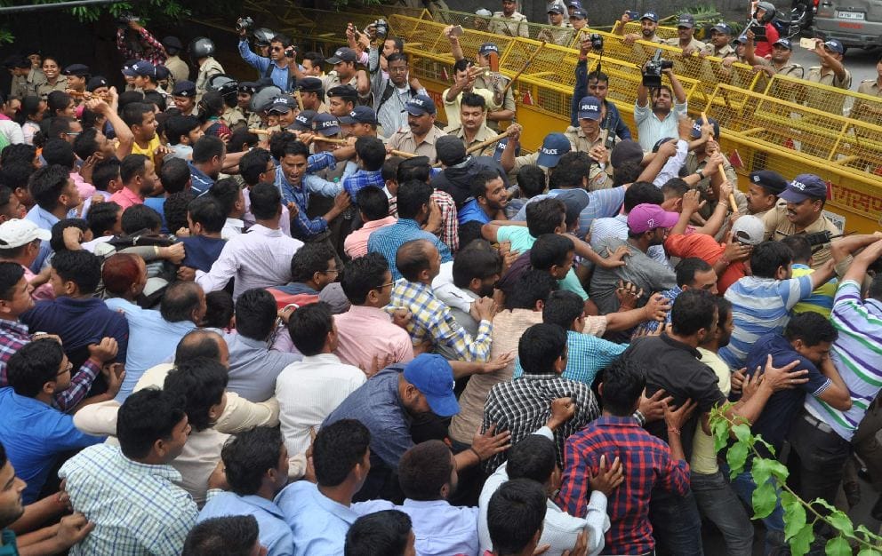photos of fight between police and guest teacher during protest 