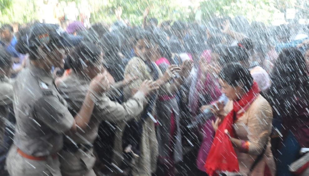 photos of fight between police and guest teacher during protest 