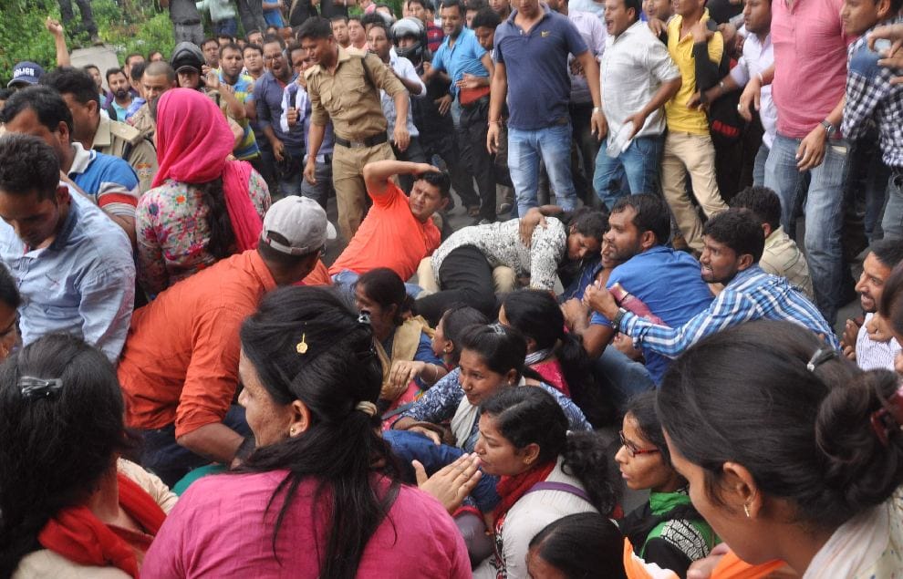 photos of fight between police and guest teacher during protest 