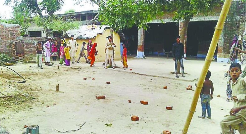 Three injured, including village head in land dispute