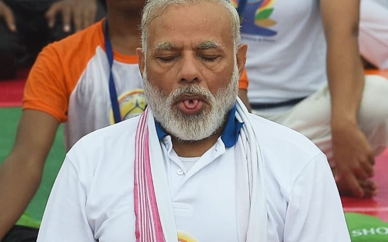 people perform yoga in Lucknow with prime minister Modi.