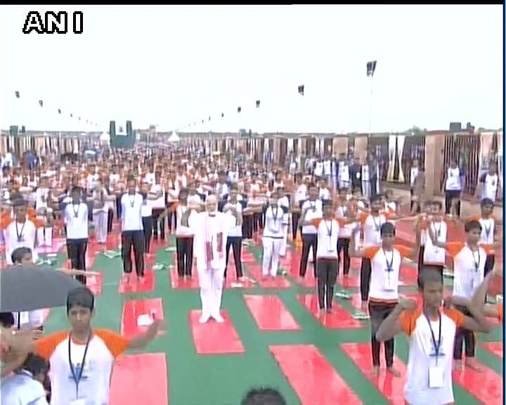 Prime Minister Narendra Modi while doing yoga despite rains in Lucknow,see photos