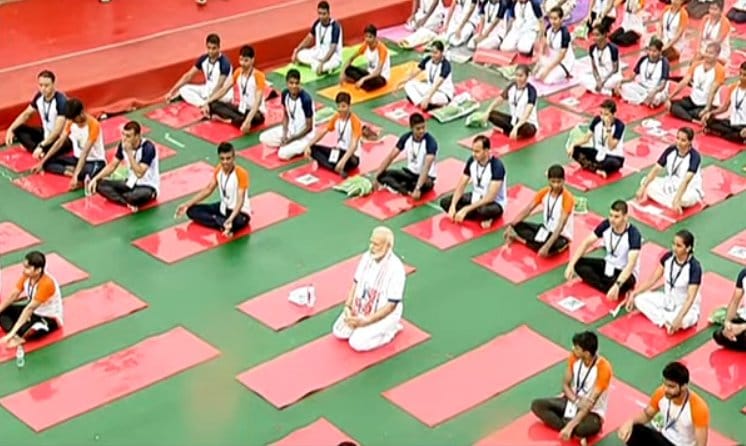 Prime Minister Narendra Modi while doing yoga despite rains in Lucknow,see photos