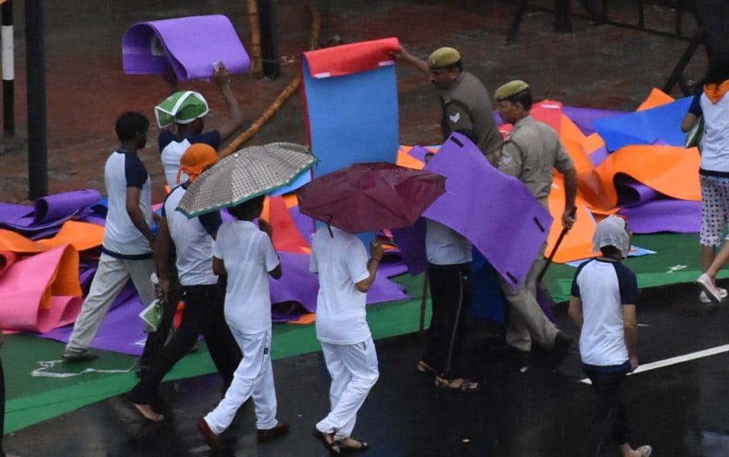  People take away mats after doing Yoga.