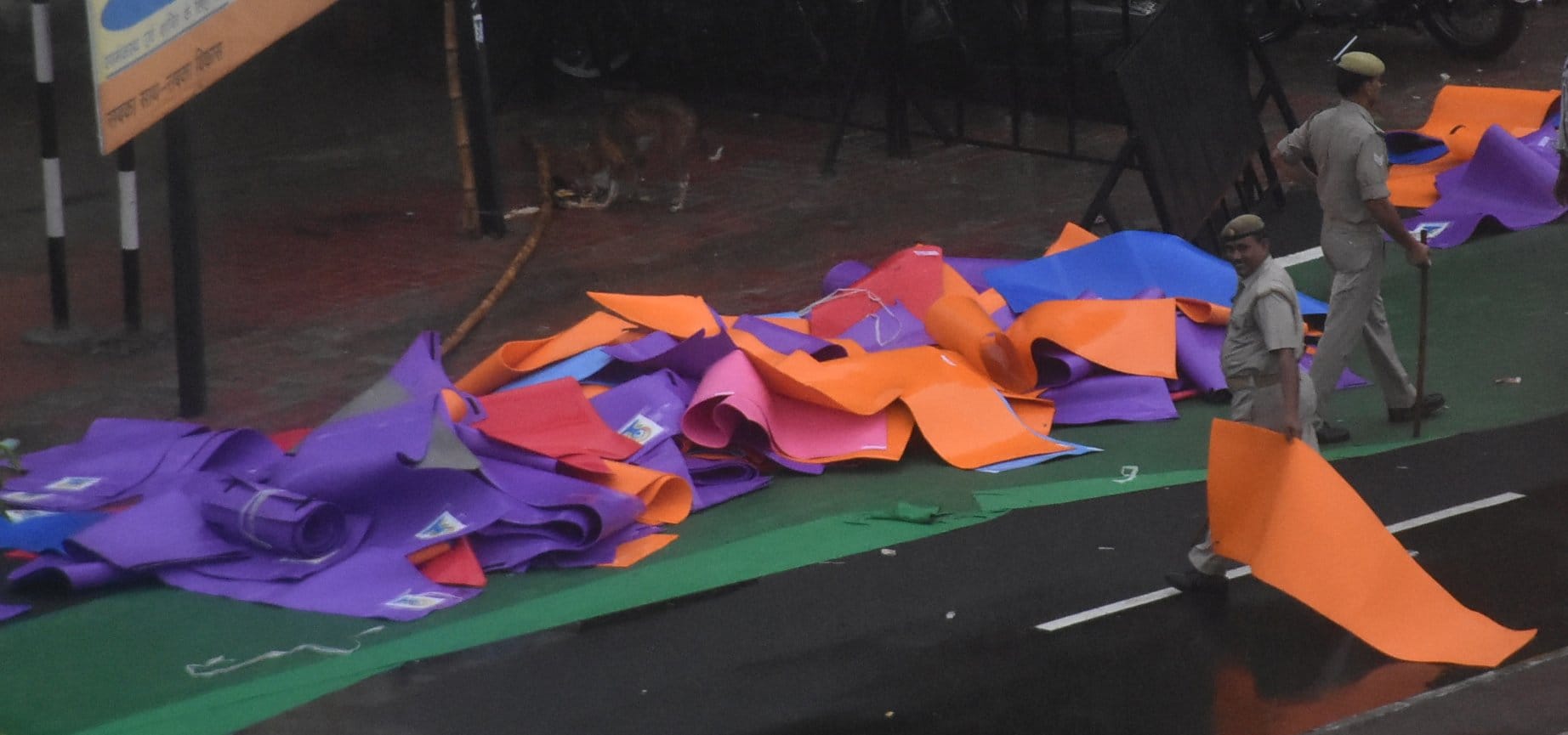  People take away mats after doing Yoga.