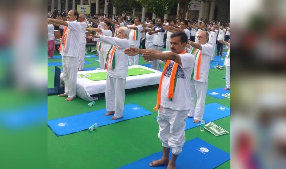 on international yoga day kejriwal and other do yoga and samajwadi party leaders ride bicycle