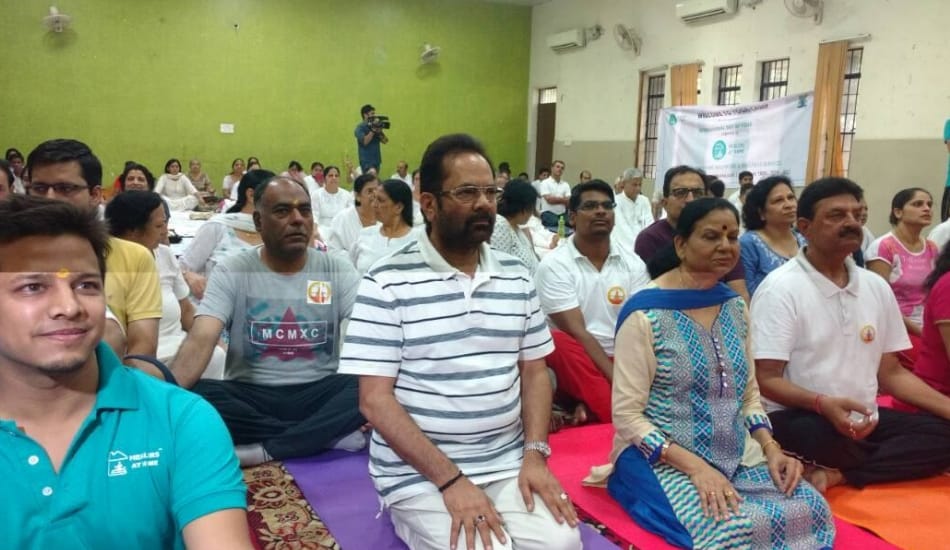 on international yoga day kejriwal and other do yoga and samajwadi party leaders ride bicycle
