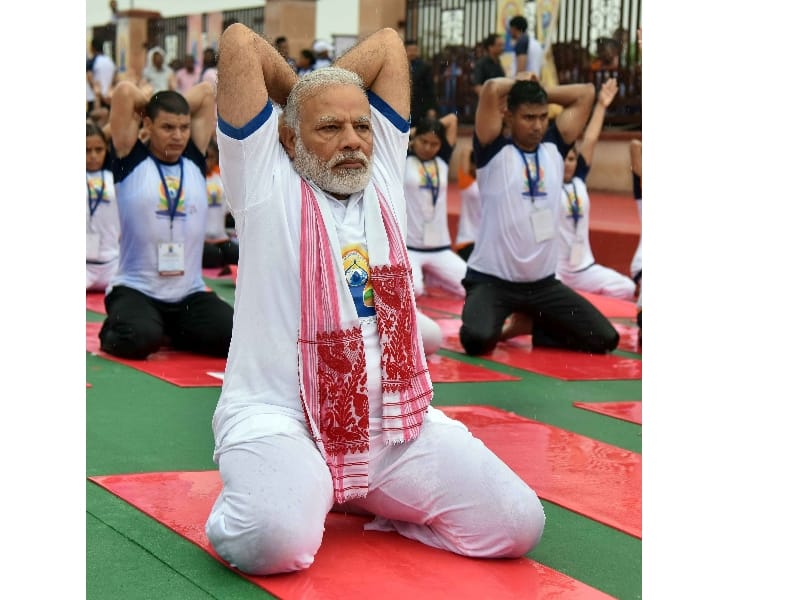  women prisoners perform yoga on international yoga day.