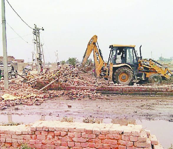 Pradhan's possession was removed from the land of village society