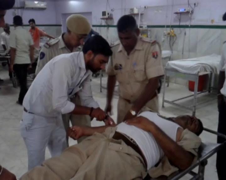 car driver dies in collision with policeman