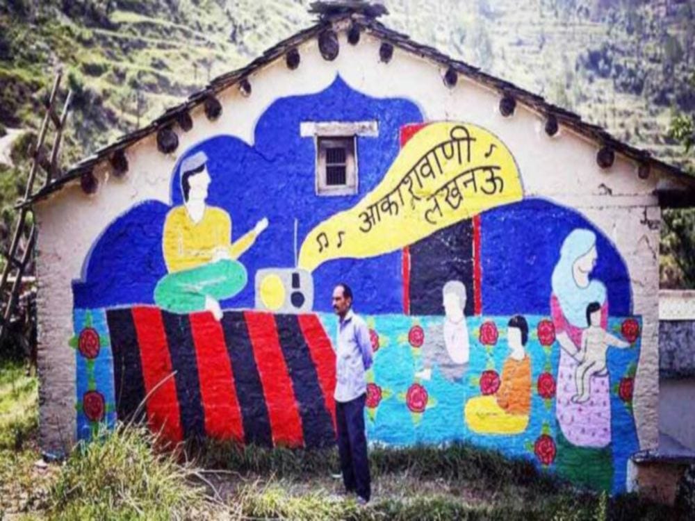 boy paint village with colours for stop Escape in uttarakhand 