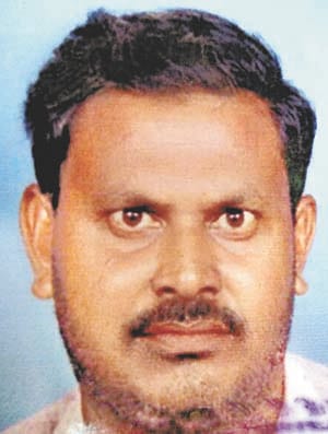 The dead body of the businessman on the street, suspected of murder