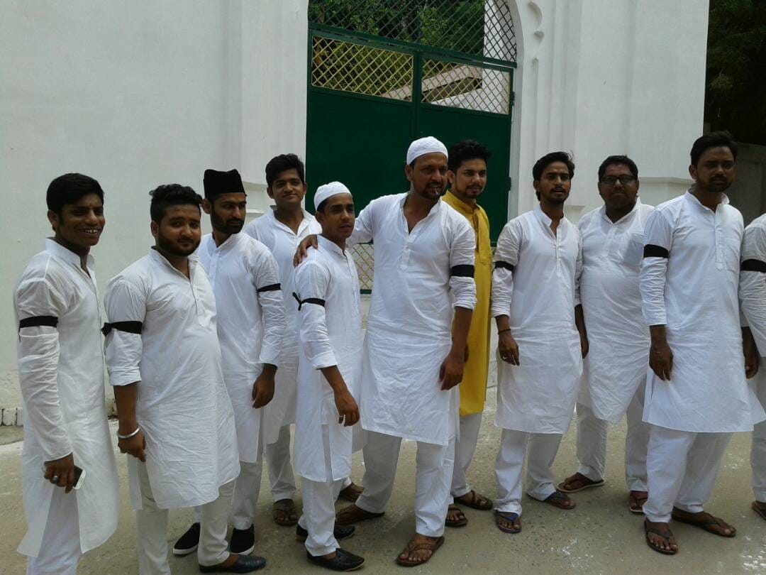 Eid prayers Muslims in Ghazipur and Mau, wearing a black band, 