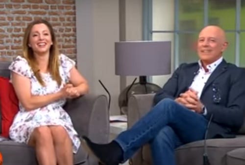 Reporter Deric O hartagain blown by the wind during live telecast of weather reoprt in Dublin