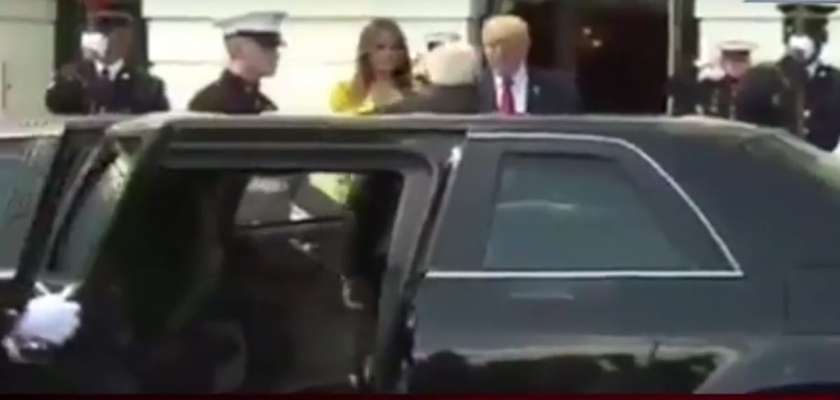 us guard open car's door to expect pm modi wife is in car
