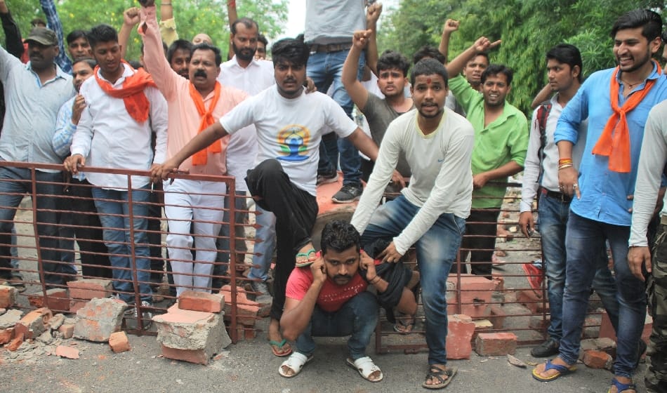 hindu organisation protest and hostage jcb driver on demolish worship area wall 
