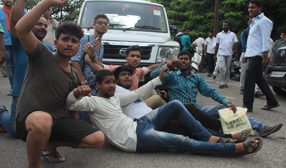  hindu organisation protest and hostage jcb driver on demolish worship area wall 