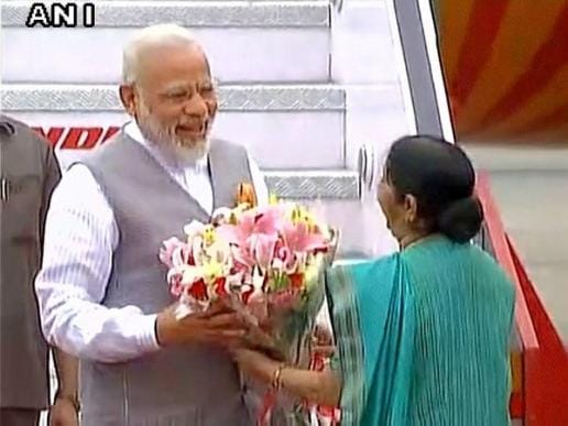 PM Modi arrives in Delhi after his three nation tour, received by Sushma Swaraj