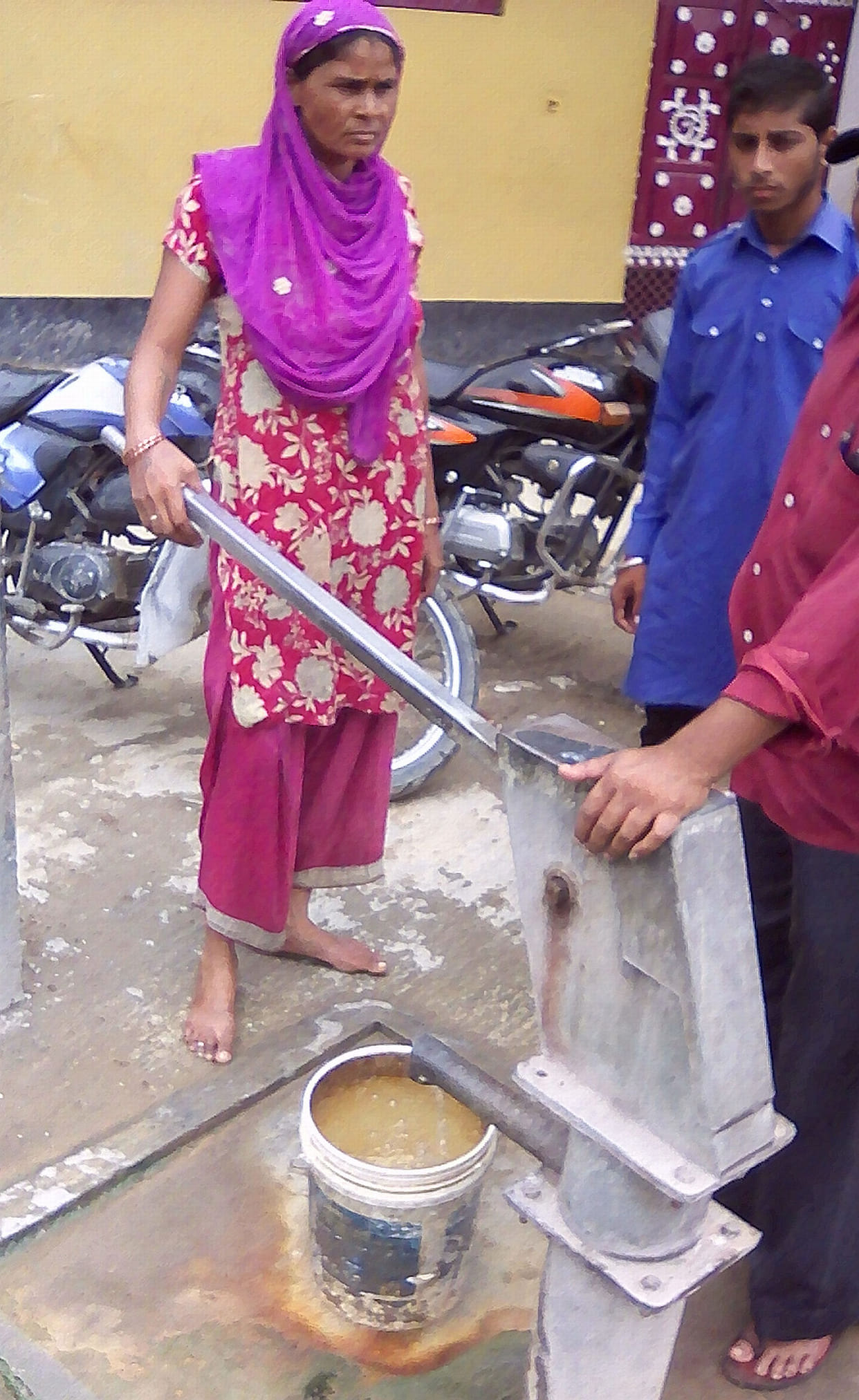 'Poison' swirling handpumps in Asauda village.