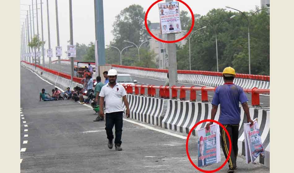 akhilesh yadav posters on elevated road that was inaugrated by yogi minister in noida